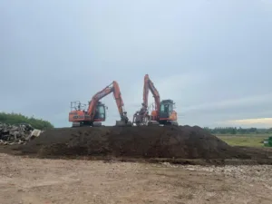 2 Doosan Diggers on Soil Heap
