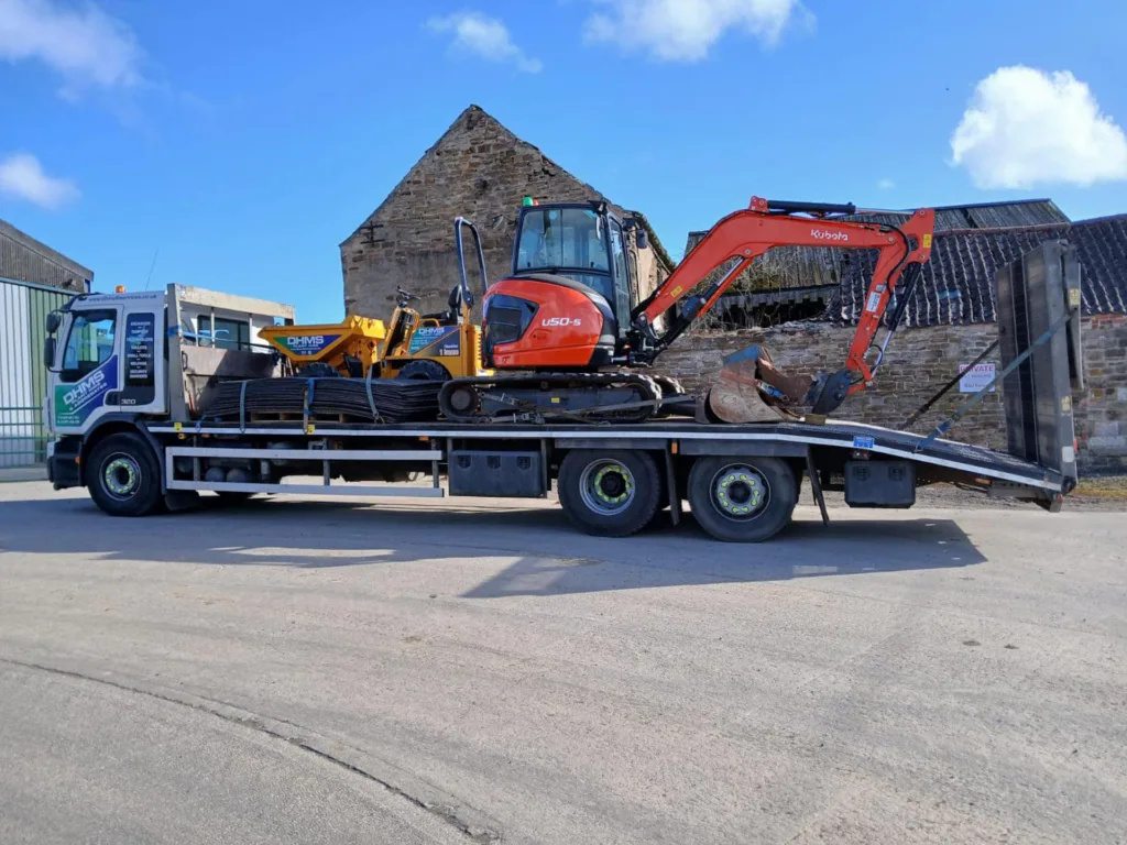 1 tonne dumper, 5 tonne Kubota excavator and ground protection mats on flatbed lorry